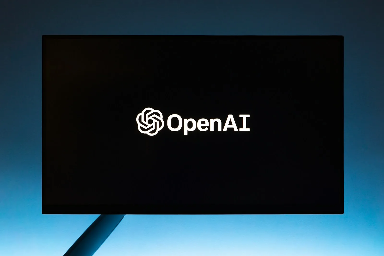 OpenAI logo displayed on a screen, representing the OpenAI Dots AI agent