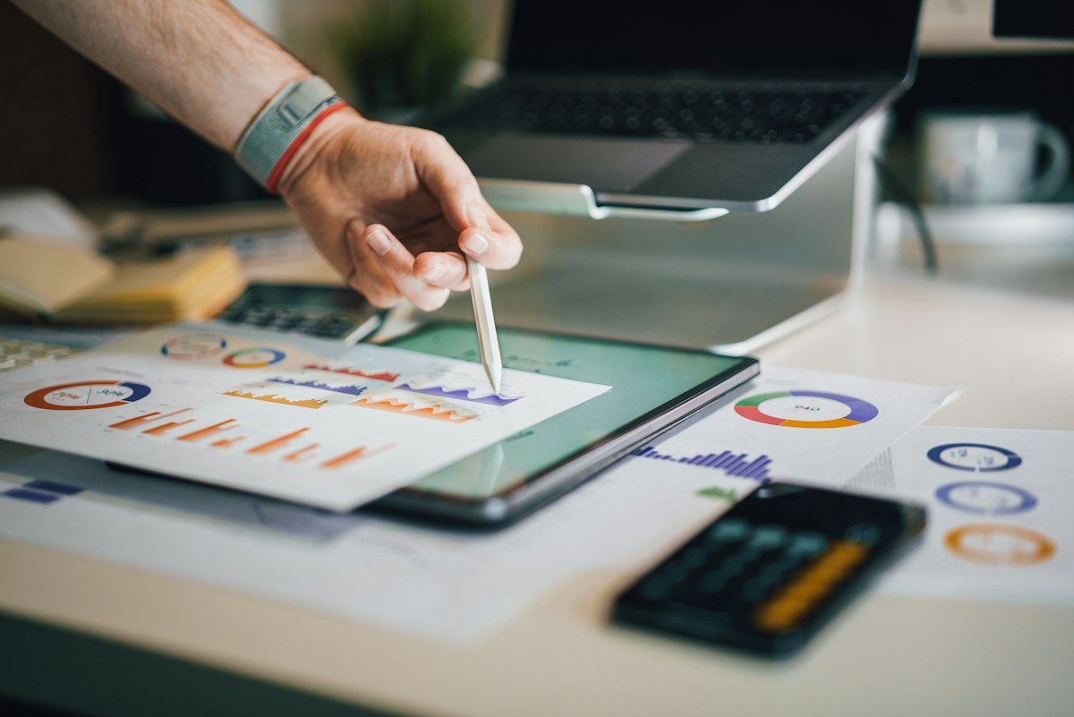 Analyst reviewing purchase rate and revenue charts from a price test