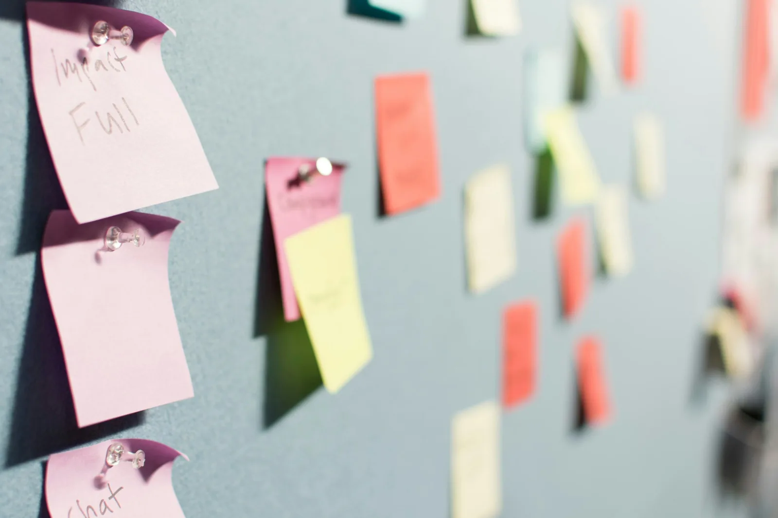 Sticky notes on a wall for planning a customer complaint review